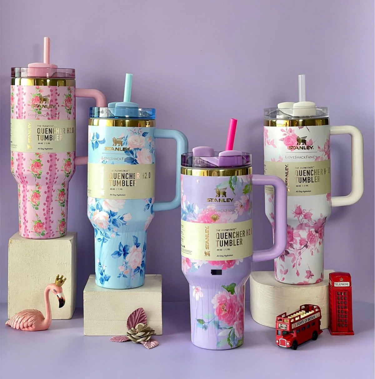 Set of floral Stanley cups on a light purple background