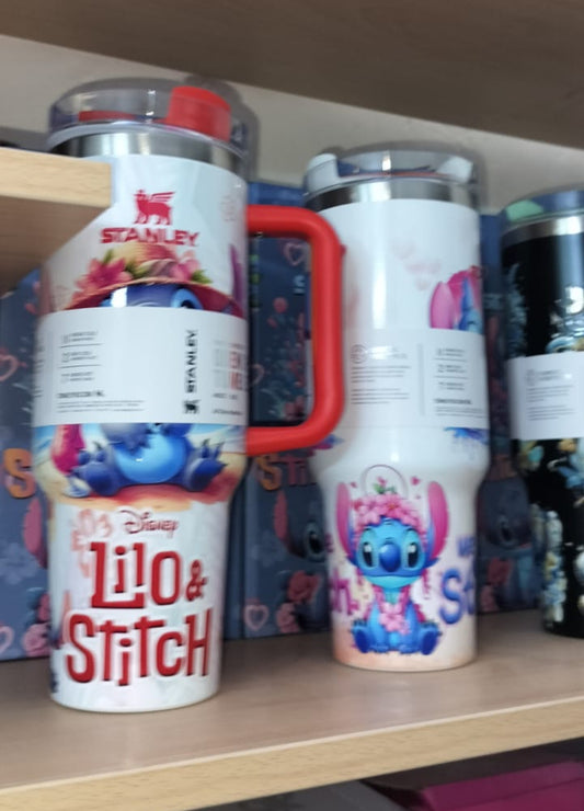 Two tumblers with 'Lilo & Stitch' design on a shelf